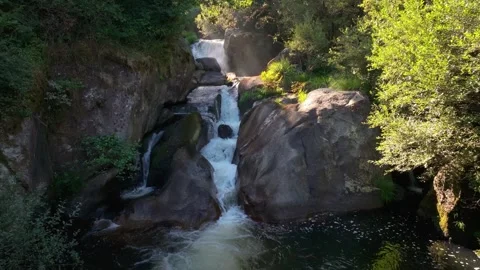 Waterfall Cascading Through Tiered Rocks On River. static shot Stock Footage 283656614