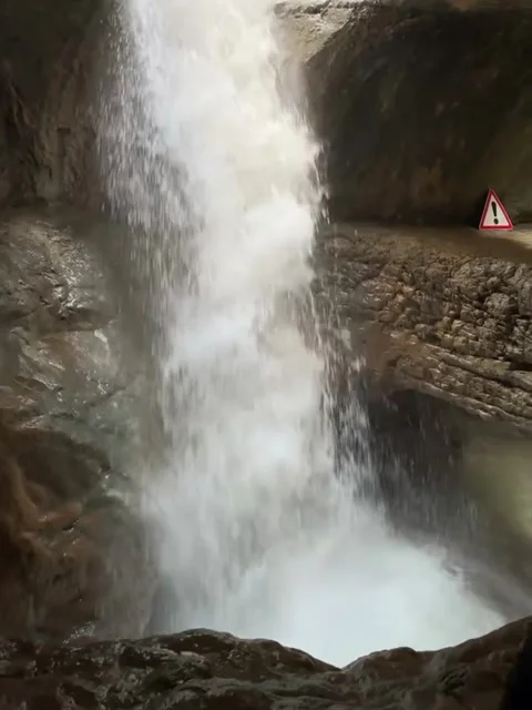 Waterfall Cascading Through Underground Rock Cave Stock-Footage 339583736