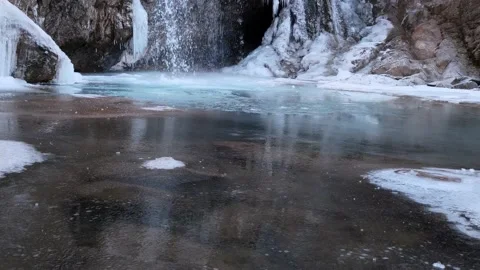 Waterfall in a cave in a cold environment, beautiful frozen landscape. Frozen Stock Footage 146418728