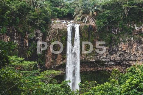 The waterfall of Chamarel Mauritius. water falling from the mountain. Stock Photos