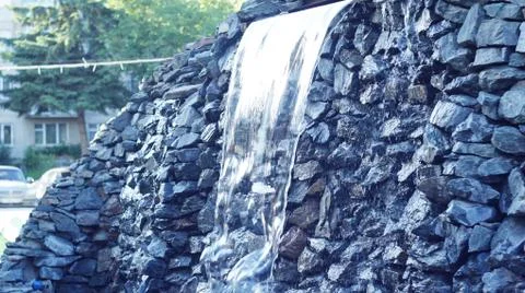 Waterfall in the city. Stock Photos
