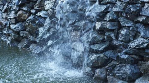Waterfall in the city. Stock Photos