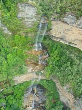 A waterfall from the cliff Stock Photos