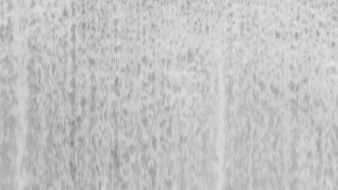 Waterfall close up - fast flowing water over a dam or barrage. 4K locked tripod Stock Footage 147949855