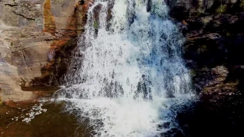Waterfall Close-Up with Upward Camera Tilt Revealing Multiple Cascades Stock Footage 292816386