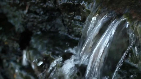Waterfall is created in a little stream Stock Footage 98678802