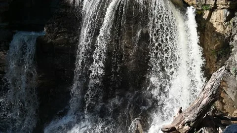 A waterfall creating shadows on the rocks Stock-Footage 219382297