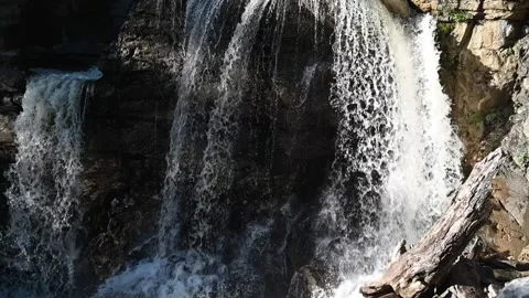 A waterfall creating shadows on the rocks (slow motion) Stock-Footage 219382152