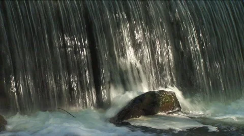 Waterfall into creek Stock Footage 311901