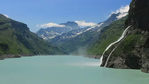 Waterfall, dam and Lac de Mauvoisin, Switzerland. Stock Footage 202128686