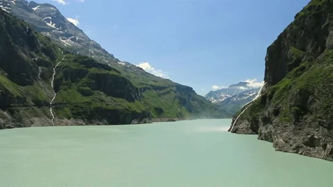 Waterfall, dam and Lac de Mauvoisin, Switzerland. Stock Footage 202136743