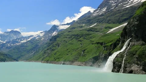 Waterfall, dam and Lac de Mauvoisin, Switzerland. Stock Footage 202139052