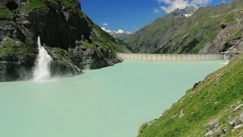 Waterfall, dam and Lac de Mauvoisin, Switzerland. Stock Footage 202144207