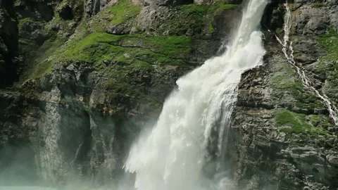Waterfall, dam and Lac de Mauvoisin, Switzerland. Stock Footage 202144864