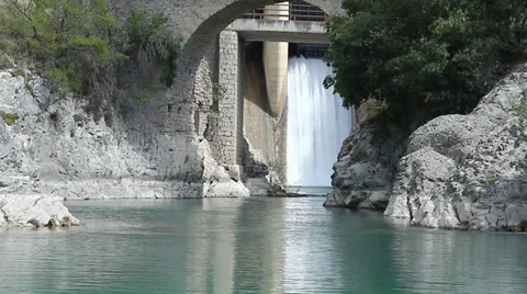 The waterfall. A dam with drainage into an river Stock Footage 34477506