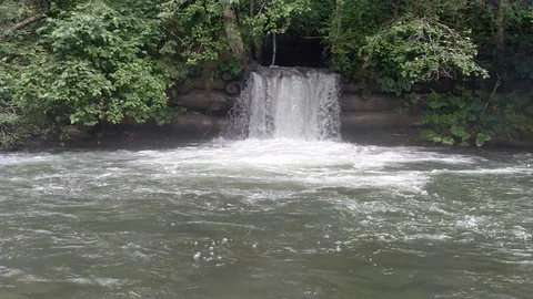 Waterfall dam Draining water Spillway Mountain river with stone Rushing Stock Footage 116719643