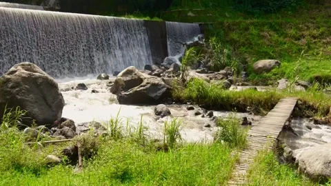 Waterfall dam river flow green beautiful nature calm village Видео 265381778