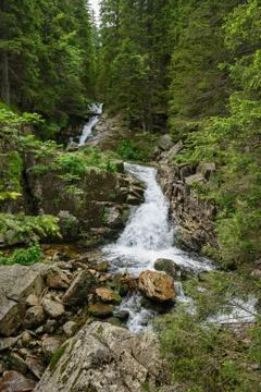 Waterfall in deep forest at mountains Stock Photos