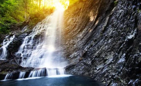 Waterfall in deep moss forest, clean and fresh in Carpathians, Ukraine. Stock Photos