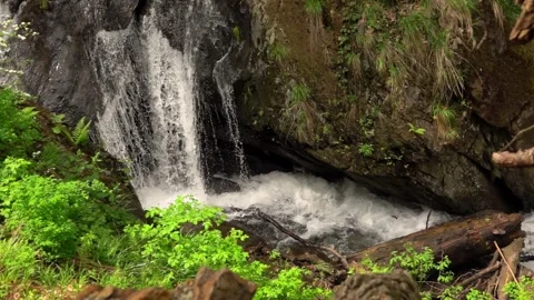 Waterfall deep into the mountains in slow motion Stockbeeldmateriaal 132958466