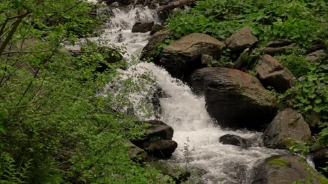 Waterfall deep into the mountains in slow motion 動画素材 132958605