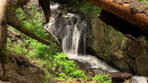 Waterfall deep into the mountains in slow motion Stock Footage 132958770