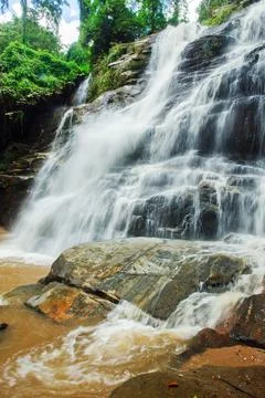 Waterfall in deep rain forest jungle. Mae Tad Waterfall, Chiang Mai, Thailand. Stock Photos