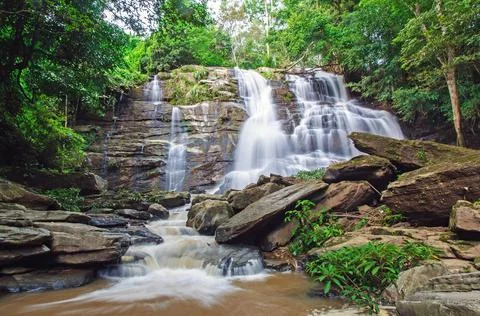 Waterfall in deep rain forest jungle. Mae Tad Waterfall, Chiang Mai, Thailand. Stock Photos