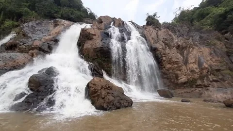This waterfall descends through dense sal forest Stock Footage 340267319