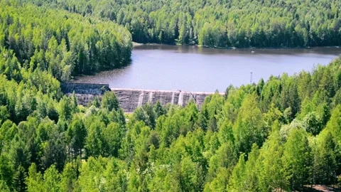 Waterfall at the diversion dam at the russian forest. Shot. Sunny day with green Stock-Footage 134691847