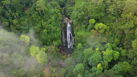 Waterfall drone out through the clouds Stock Footage 340969391