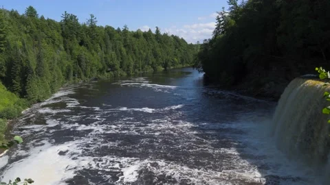 Waterfall at drop-off point of Higher Falls of Tahquamenon Falls Stock Footage 166118803