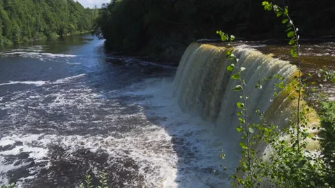 Waterfall at drop-off point of Higher Falls of Tahquamenon Falls Stock Footage 166118920