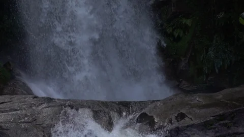 Waterfall dropping on rock slow motion Stock Footage 74271568