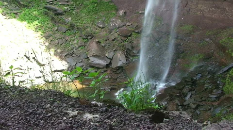 Waterfall dropping Water onto Rocks Stock Footage 458533