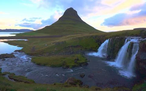 Waterfall in the evening in the mountains Stock Photos