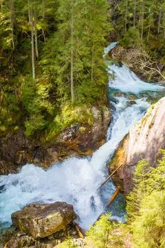 Waterfall in evergreen forest Stock Photos