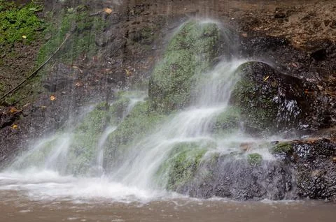 A waterfall is a fall of water in a river from a ledge Stock Photos
