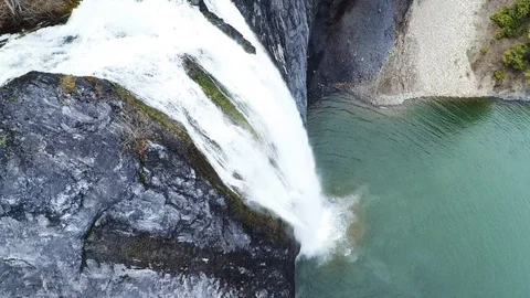 Waterfall Falling from Cliff Face Stock Footage 128980684
