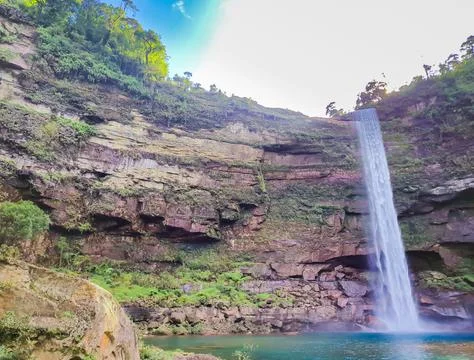 Waterfall falling from mountain at day from different angle Foto stock