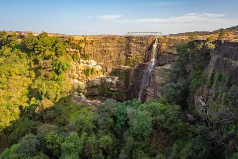 Waterfall falling from mountain top at forests at day from flat angle Stock-Fotos