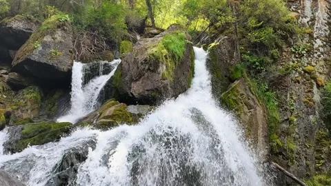 Waterfall falling from mountains in summer day, close up. Stock Footage 166248889