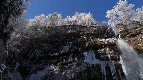 Waterfall falling over a cliff face in the Julian Alps Stock Footage 118972533