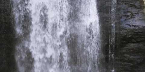 Waterfall falling from the rocks in slow motion. Looking Glass Falls, NC   Stock Footage 103818828