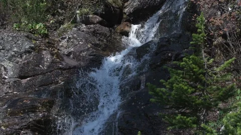 Waterfall falls in cascade in mountain gorge. Stock Footage 143951844