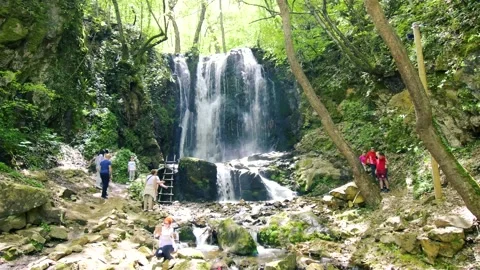 Waterfall falls down the mountain Stock Footage 163121976