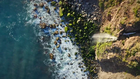 Waterfall Falls Into Ocean At Sunset Stock Footage 190563273