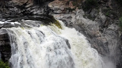 Waterfall fast flowing down the swollen mountain Stock Footage 114902086