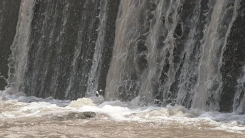 Waterfall flow to the surface of the river Stock Footage 234940932