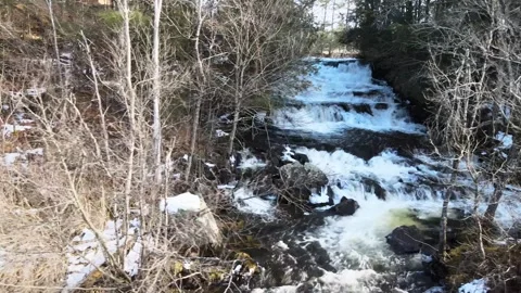 Waterfall flowing aerial view while panning to the right in Paradox NY Vidéo 268444756